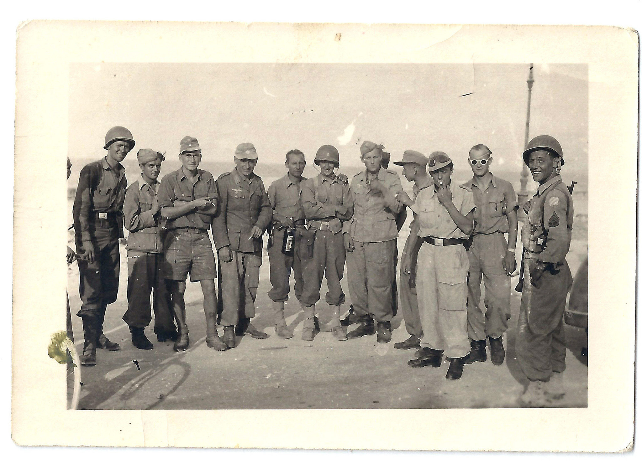 In the photo are three GI's and a number of captured German soldiers.